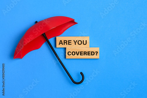 Red Umbrella Symbolizing Insurance Protection and Coverage Question