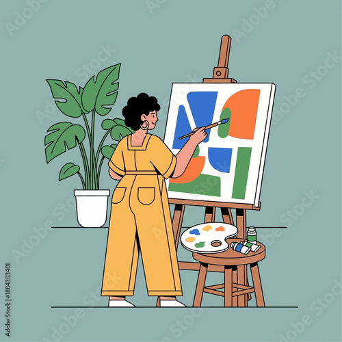 Creative female artist painting abstract art on canvas.