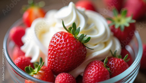 Delicious bowl of strawberries topped with creamy whipped cream freshly prepared