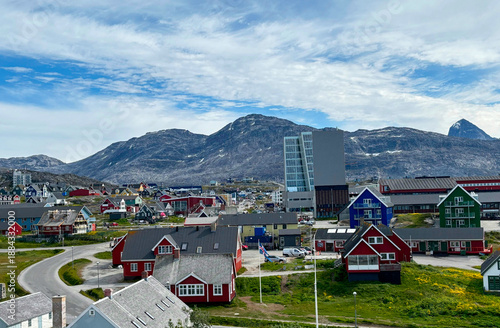 Colorful houses in Nuuk city, Greenland with mountains and modern buildings in background