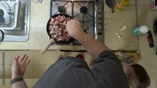 Parent Cooking with Child in Kitchen