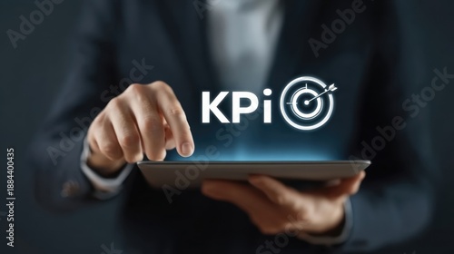 Business Professional Analyzing Key Performance Indicators on Tablet with Focus on KPI Metrics and Target Graphics
