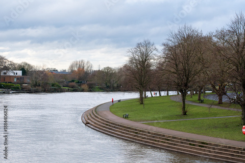 Fototapeta A riverscape over the river Trent as seen from the  Wilford Suspension Bridge in Nottingham, UK