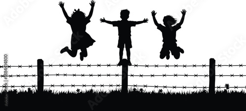 Three children silhouettes jumping joyfully above barbed wire fence and grass kids