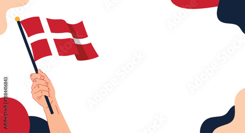 Hand holding the national flag of Denmark against a background with abstract shapes, a design for national holidays and celebrations.