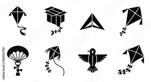 Collection of black silhouette icons depicting kites a parachute and a bird
