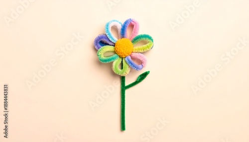 Vibrant and handcrafted pipe cleaner flower, arranged in a delightful flat lay, showcasing playful creativity and simple artisanal charm for decorative branding
