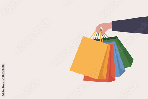 Hand Holding Colorful Shopping Bags After a Successful Shopping Trip, consumer lifestyle concept