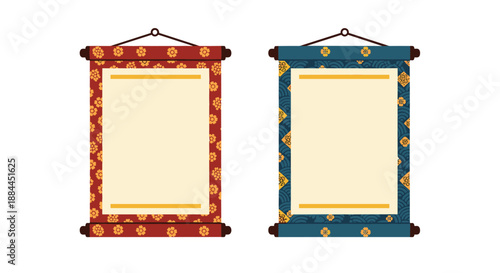 Two ornate Japanese hanging scrolls with decorative floral and wave borders surrounding blank center spaces.