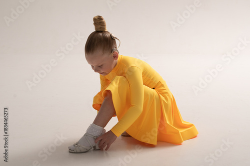 Young girl with cochlear implant in studio. Hearing impairment rehabilitation, auditory therapy, assistive hearing technology, inclusive childhood development, and confidence building