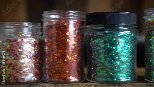 Various jars filled with colorful glitter, creating a sparkling and vibrant display.