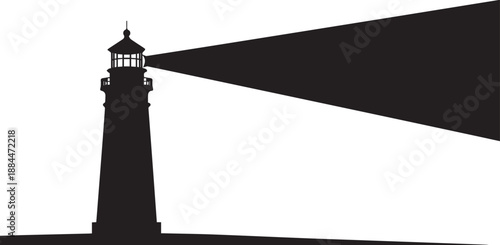 Lighthouse emitting light beam into the dark sea at dusk from a rocky coastline viewpoint