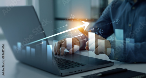 Cuadro en lienzo Businessman using laptop  analyzing sales data and financial report