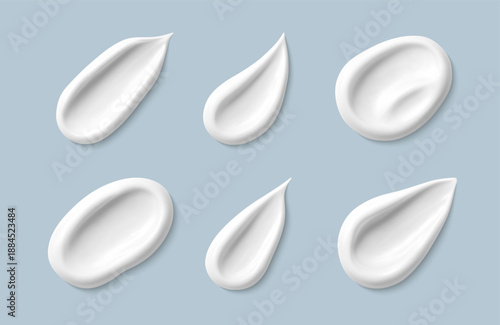 Cosmetic smears of creamy texture isolated on blue background. Set of cosmetic cream swatches. Cosmetic skin care product. Vector realistic illustration