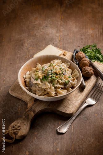 farfalle pasta with porcini mushrooms, taleggio cheese, walnuts and parsley