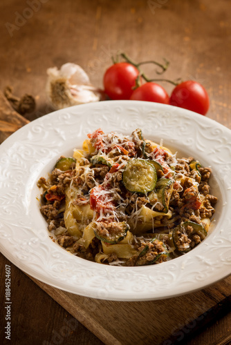 Tagliatelle with white ragout zucchinis and tomatoes