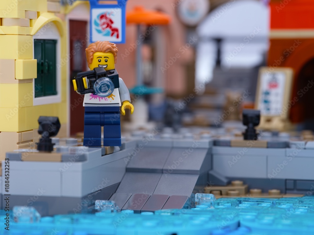 Fototapeta premium Tambov, Russian Federation - January 05, 2026 Lego man minifigure with camera standing on a dock