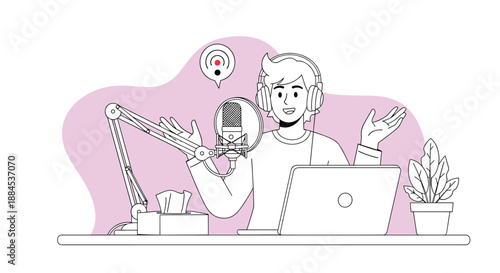 Young man wearing headphones speaking into a professional microphone while recording a podcast or live stream on his laptop at a desk.