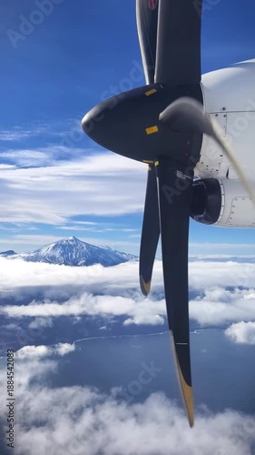View from the airplane window on the propeller while flying above the clouds	