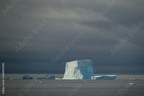 Many icebergs against a stormy, cloudy sky in the South Scotia Sea enroute to the South Orkney Islands.