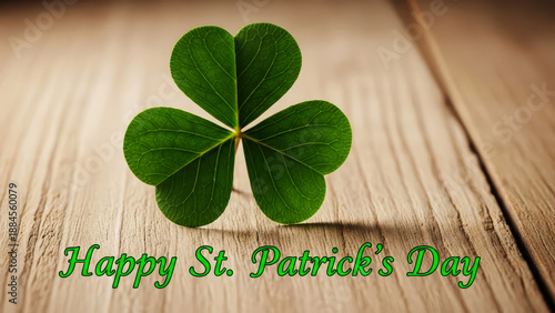 Green shamrock clover on rustic wood for St. Patrick's Day