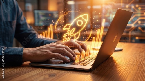 Tech Launchpad: An individual sits at a wooden desk, engrossed in their laptop as a rocket soars from its screen, symbolizing new beginnings, innovation, and technological advancement.