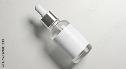 Clear glass dropper bottle with blank white label, angled on a clean minimalist background. Perfect for cosmetic serums, essential oils, or pharmaceutical liquids, symbolizing purity