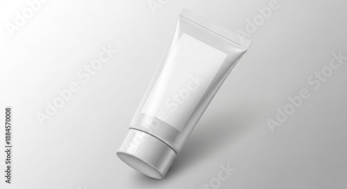 Blank white plastic cream tube mockup with a flip-top cap, ideal for beauty, skincare, and cosmetic product packaging design on a minimalist studio background