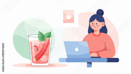 Woman working on laptop with a refreshing drink beside her
