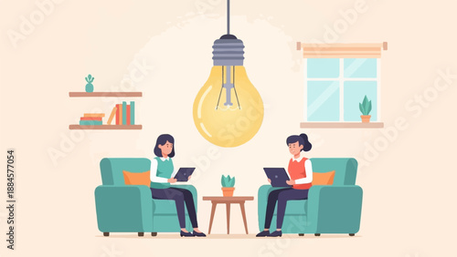 Two women on sofas under a giant light bulb, working on tablets