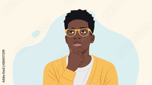 Young man in yellow cardigan and glasses thinks deeply