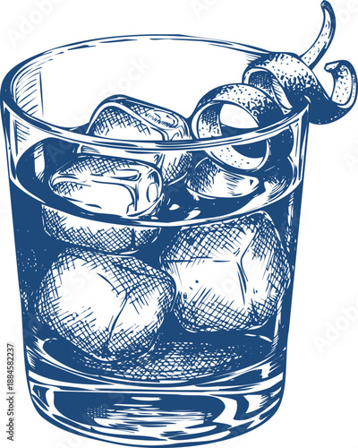 Rich amber liquid in rocks glass with large ice cubes and citrus peel