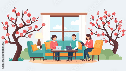 People working on laptops around a table with spring blossoms