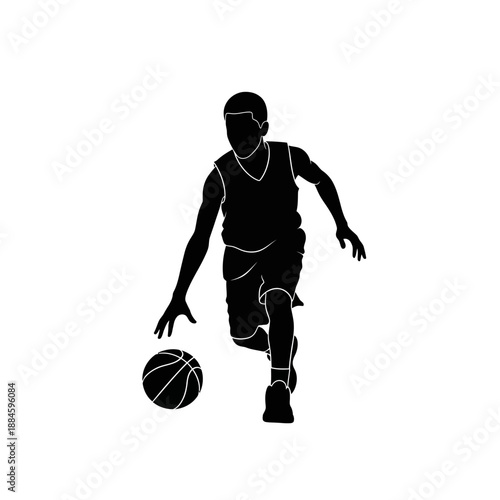 Silhouette of a young basketball player dribbling a ball