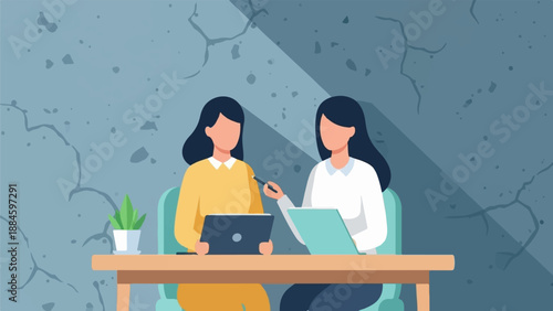 Two women collaborate at a table with laptops and a tablet