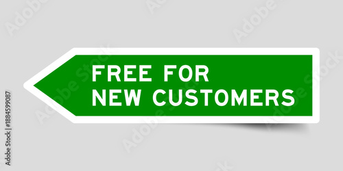 Green color arrow shape sticker label with word free for new customers on gray background