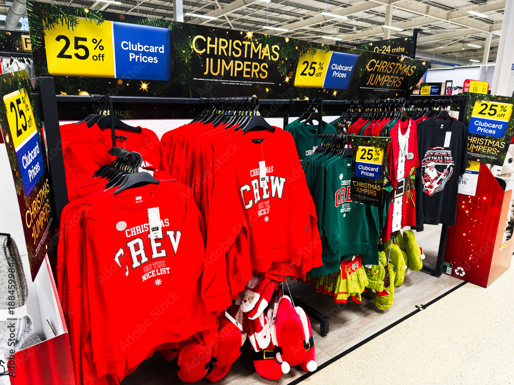 Obraz premium Manchester store displays Christmas jumpers and crew sweaters on sale with 25 off discount