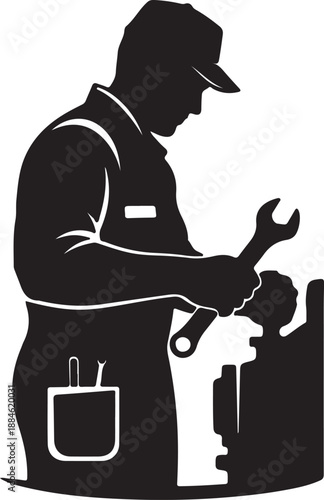 Mechanic working with a wrench on a machine part in a workshop setting