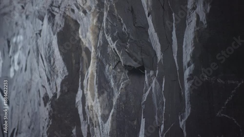 Mining Wall Details, Rusty Veins And Rugged Surface, Jagged Mineral Deposit Face With Blue Illumination