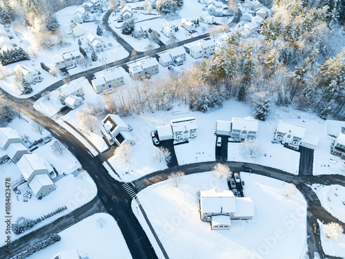 aerial view of residential community in winter after snow under sunlight © nd700