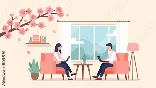 People working on laptops in a cozy living room with cherry blossoms