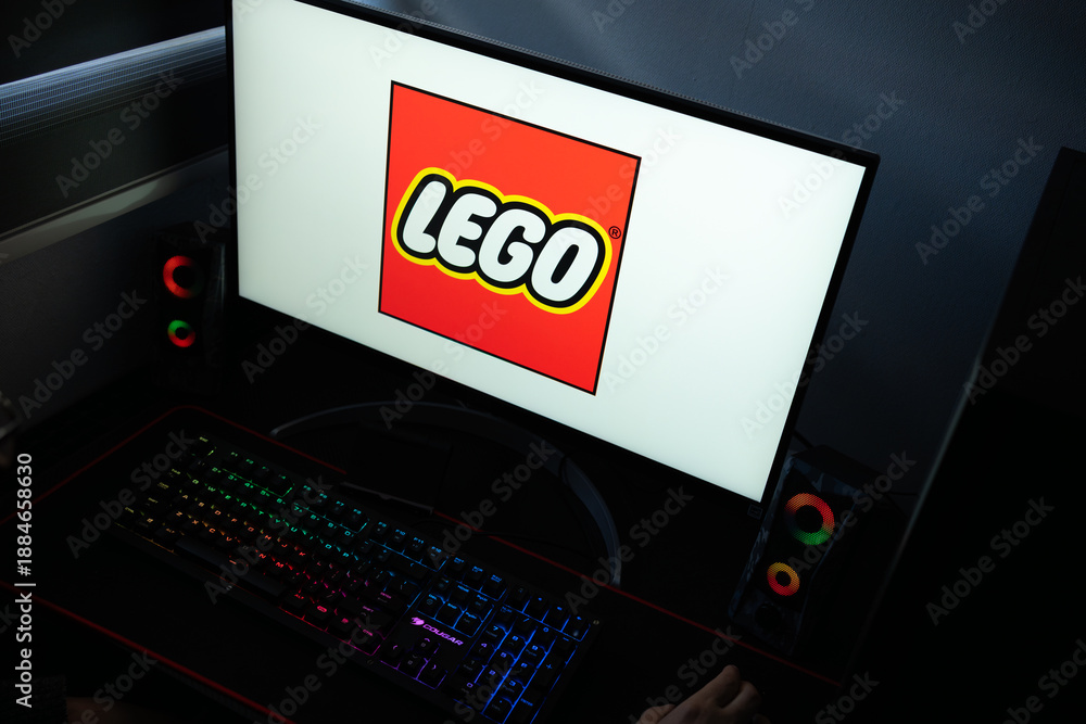 Fototapeta premium Punta Arenas, Chile – January 20, 2026: Iconic red and yellow LEGO Group logo displayed on a computer monitor in a dark office setting