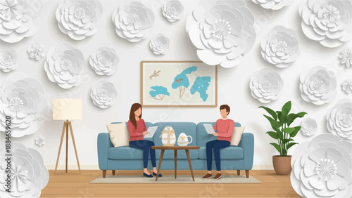 Two people sit on a sofa surrounded by large white paper flowers