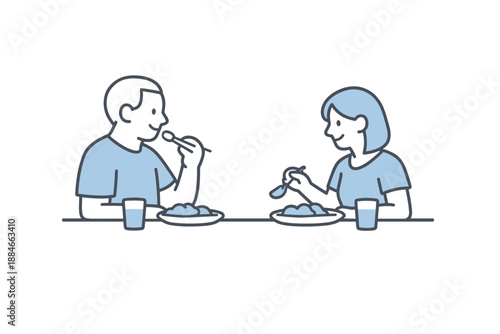 Minimalist Family Dinner. Two family members sit at a dinner table facing each other, enjoying a quiet shared meal, minimalist