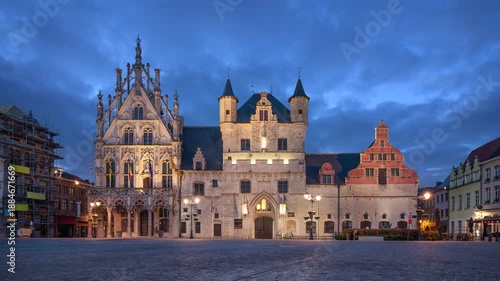 Mechelen, Belgium. Historic building of Town Hall at dusk (static image with animated sky)