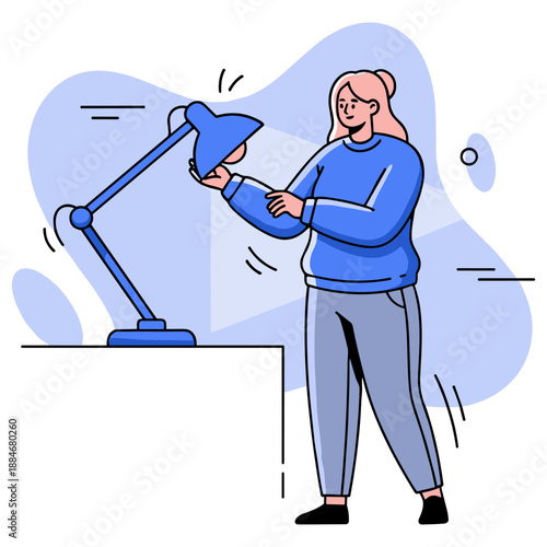 Female adjusting desk lamp in blue sweater with abstract background