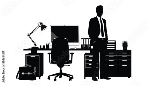 Silhouette of businessperson standing beside desk in professional office setup with work essentials
