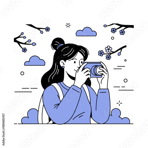 Asian female capturing nature with camera in spring blossom setting