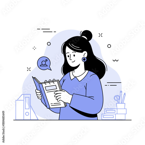 Smiling asian female adult reading a book in an office setting