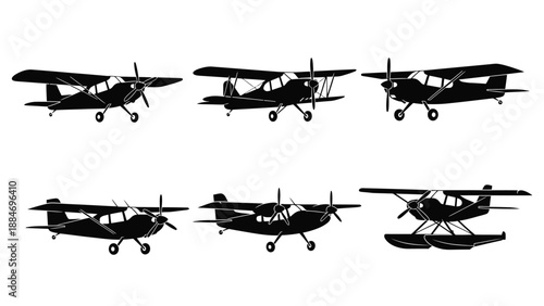 Silhouettes of vintage biplanes in varying perspectives and configurations